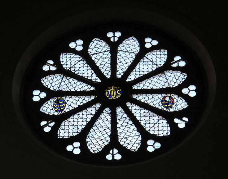 a circular stained glass window with paw prints