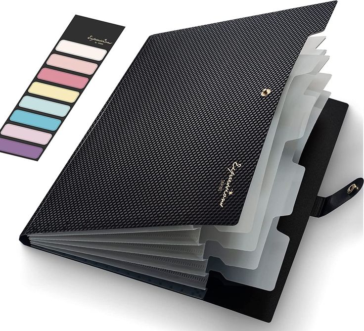 a black binder with five different colored labels on it