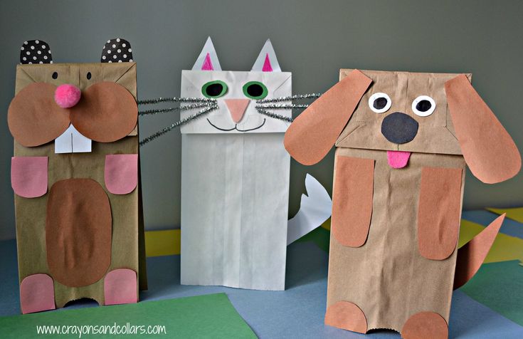 three paper bags with dogs and cats on them