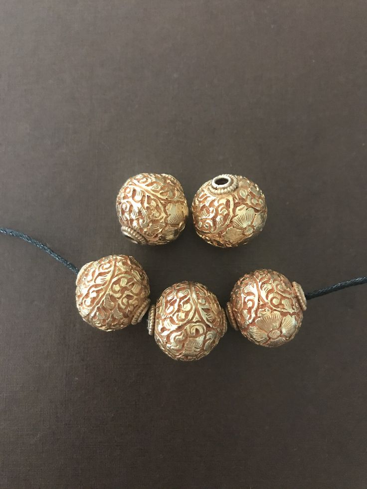 This listing is for 1 bead. These 24k gold washed copper beads were handcrafted in Nepal. Each bead is approximately 20x20 mm and weighs about 10.8 gm. Images may appear enlarged or smaller. Please refer to the measurements given. Please contact us for wholesale pricing on bulk orders. Handmade Gold Jewelry With Oval Beads, Artisan Gold Jewelry With Round Beads, Gold Beaded Copper Jewelry Gift, Gold Jewelry With Polished Metal Beads, Bohemian Gold Jewelry With Large Beads, Gold Metal Beads For Jewelry Making, Gold Bohemian Jewelry With Large Beads, Large Gold Beads For Jewelry Making, Handmade Adjustable Gold Beads