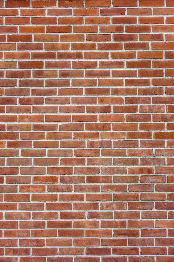 a red brick wall is shown in this image