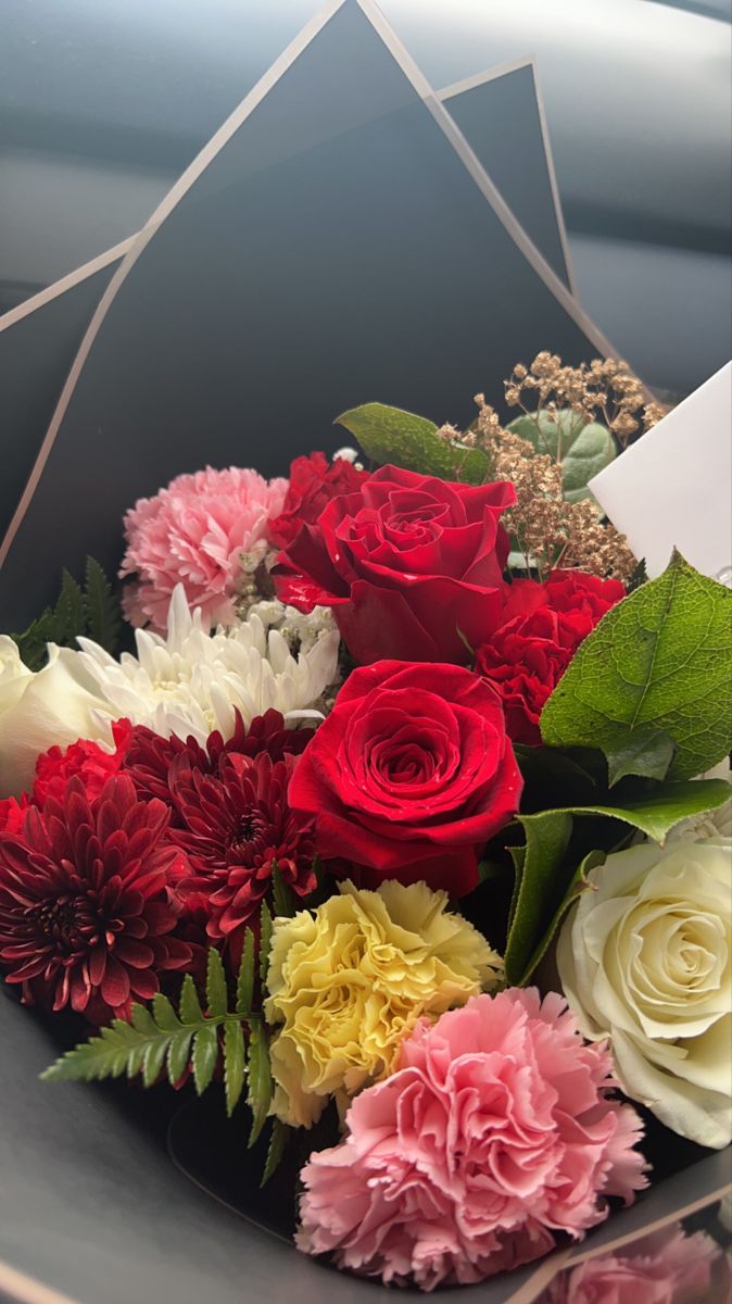 a bouquet of flowers sitting on top of a table