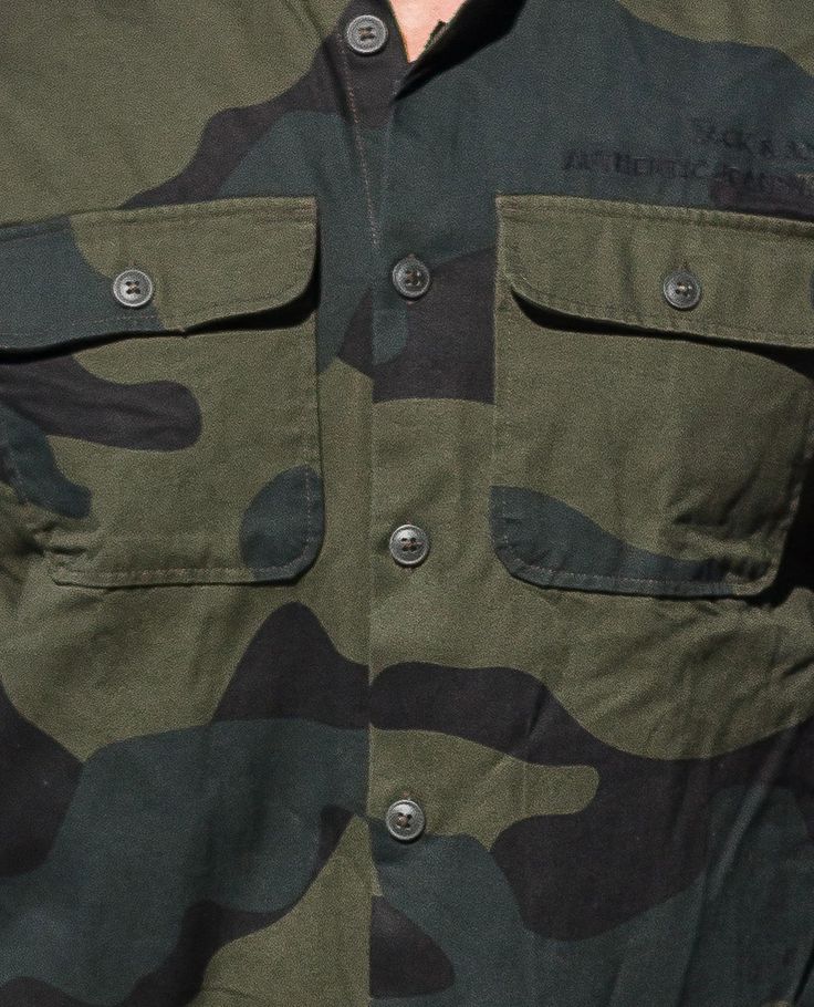 JACK & JONES army patterned shirt. Can be worn alone or open, over a t-shirt. Classic button fastening, chest pockets. Military Cotton Shirt For Streetwear, Military Style Khaki Tops With Patch Pockets, Cotton Military Shirt For Streetwear, Khaki Military Top With Patch Pockets, Khaki Military Tops With Patch Pockets, Military Style Cotton Shirt For Streetwear, Military Streetwear Shirt With Pockets, Military Style Streetwear Shirt With Pockets, Casual Camouflage Shirt For Outdoor