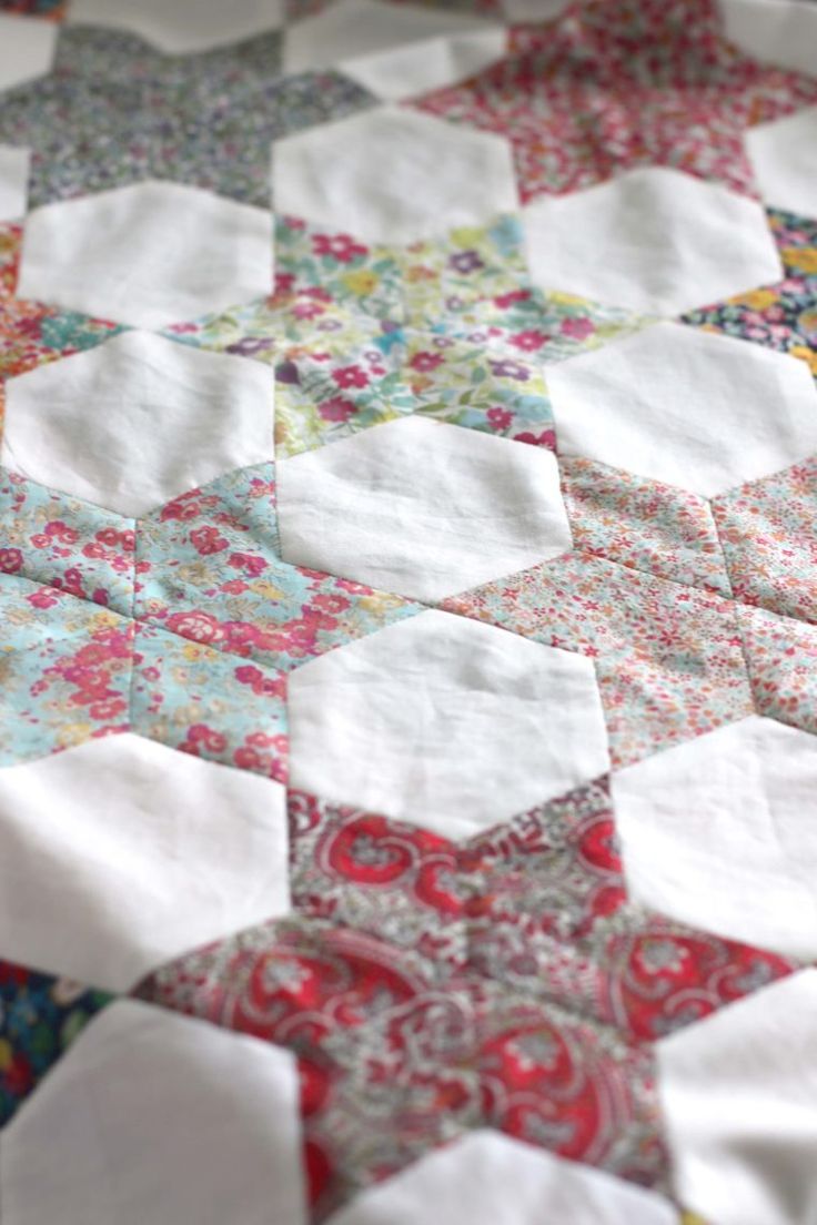 a close up of a quilt on a table