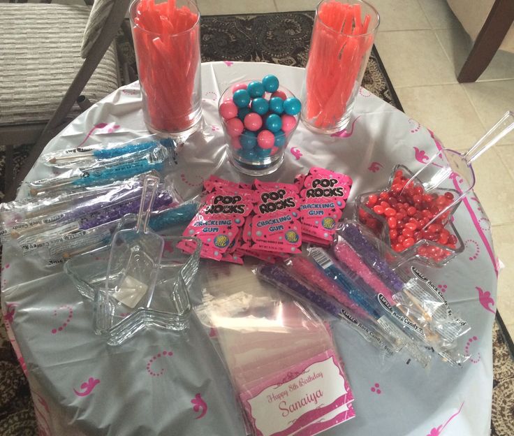 a table topped with candy and candies