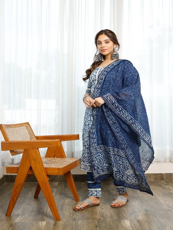 Affordably stylish every day clothing. This handmade indigo bagru print A cotton a-line kurti with gota detailing is tastefully decorated with flower designs. includes a lace-trimmed pant and a chanderi indigo-printed dupatta with paisley borders on the ends. You must have ethnic clothing in your collection this season. Neck: Round Neck Sleeve Length: 3/4th Sleeves Kurta Length: Calf Length Fabric: Kurta & Bottom - Cotton Dupatta - Chanderi Note: Wash Care Instructions - Dry Clean Only. The prod Diwali Cotton Anarkali Set With Bandhani Print, Cotton Anarkali Set With Block Print For Eid, Cotton Bandhani Print Anarkali Dupatta, Blue Bohemian Salwar Kameez With Bandhani Print, Cotton Kalamkari Print Dupatta For Navratri, Bohemian Indigo Traditional Wear For Navratri, Cotton Kurta With Block Print For Diwali, Cotton Kurta With Ikat Print For Eid, Cotton Bandhani Print Salwar Kameez With Straight Kurta