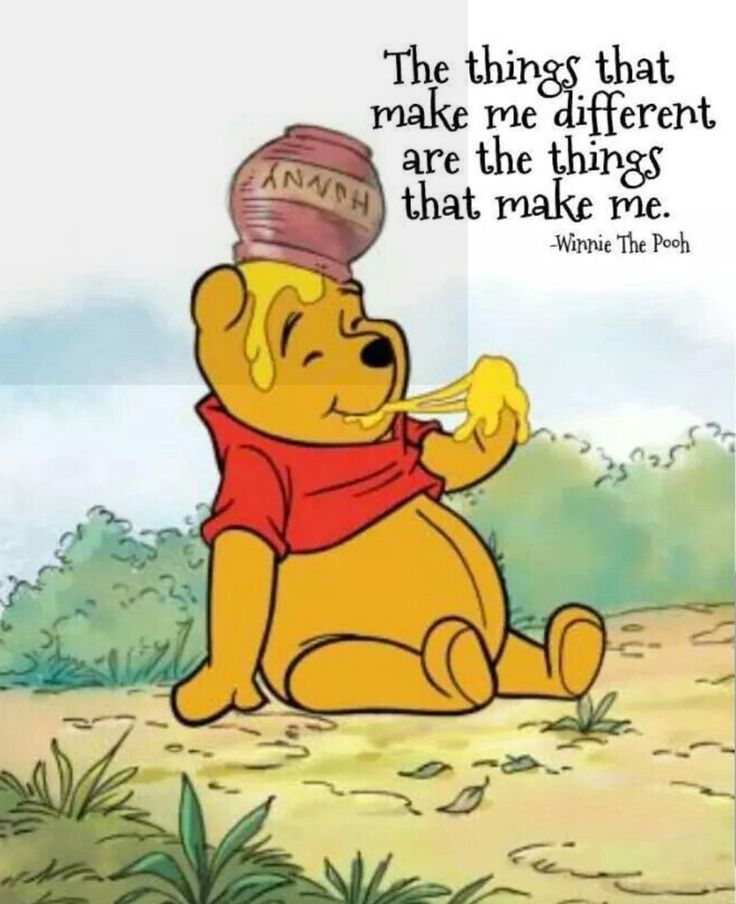 winnie the pooh is sitting on the ground with a honey pot on his head