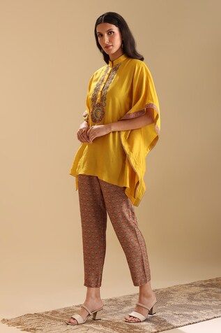 Yellow chanderi kaftan with floral embroidered placket and beaded embellishments. Paired with a contrast pant with floral butti prints. - Aza Fashions Traditional Embroidered Silk Pants, Traditional Chanderi Kaftan With Embroidered Border, Festive Sets With Resham Embroidery In Tunic Shape, Festival Straight Kurta Kaftan With Embroidered Border, Embroidered Traditional Drape Kaftan For Festivals, Traditional Draped Embroidered Kaftan For Festivals, Festive Kaftan With Embroidered Border, Bohemian Silk Sets With Embroidered Border, Traditional Yellow Pants For Festive Occasions