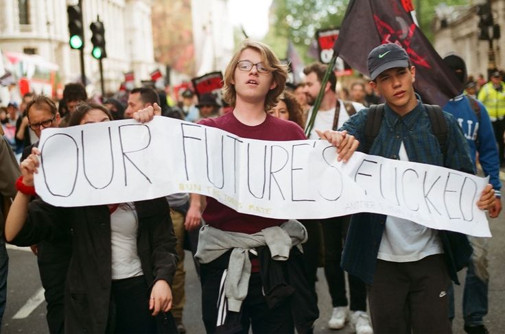 some people are walking down the street holding signs that say our future is sticker