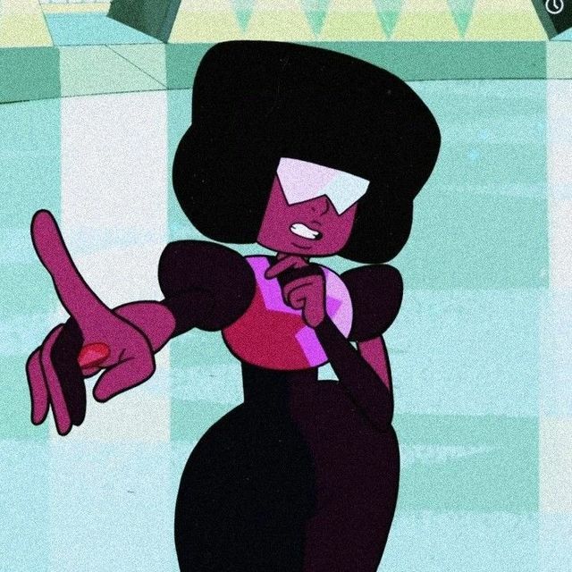 an animated woman in a black dress pointing to the right with her hand on her hip