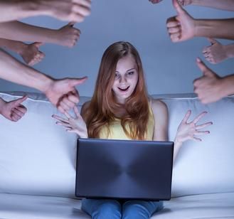 a woman sitting on top of a couch surrounded by hands