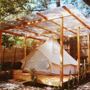 a tent set up in the middle of a yard