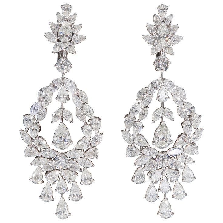 Beautiful diamond drop earrings in a stunning design. 22.05 carats of diamonds, the center pear shape drops measure as carat sizes. 18k white gold Approximately 2.63 inches in length, an inch wide at its widest point. Made in New York Antique Diamond Earrings, Carat Sizes, Diamond Chandelier Earrings, Diamond Chandelier, Earrings Diamond, Vs Diamond, Antique Diamond, Diamond Drops, Van Cleef