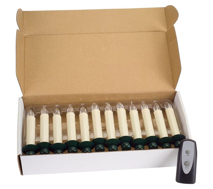 an open box with candles in it on a white background