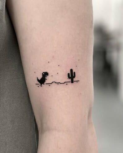 Cactus With Dinosaurs Simple Tattoo Dinasour Tattoo Tiny, Henna Dinosaur, Matching Gaming Tattoos, Funny Dinosaur Tattoo, Dinasour Tattoo Small Cute, Simple Guy Tattoos, Dino Tattoo Ideas, Silly Small Tattoos, Small Sleeve Tattoos