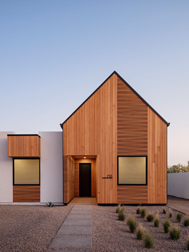 the instagram page on instagram shows an image of a house with wooden siding