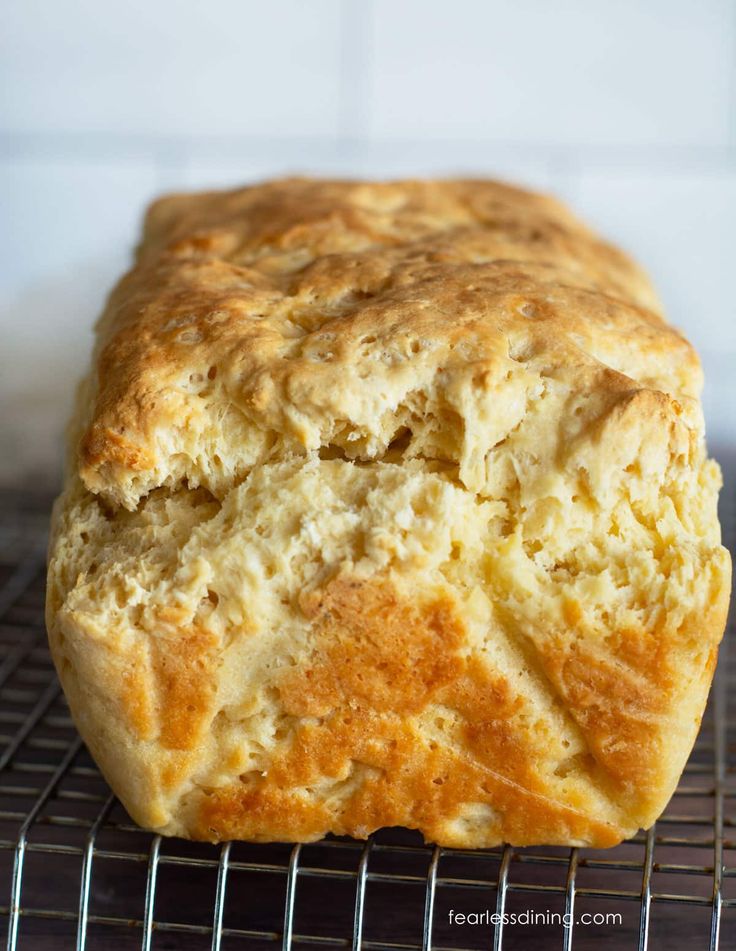 a loaf of bread sitting on top of a cooling rack