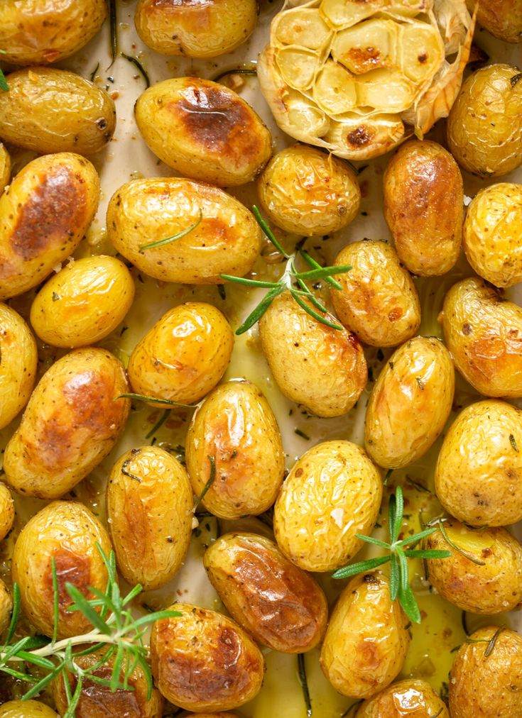 roasted potatoes with rosemary sprigs on top