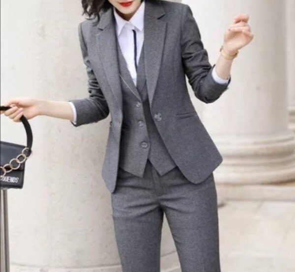 This unique ladies suit is designed with high quality wool material that guarantees durability and comfort. It is suitable for all kinds of occasion and it can be worn all year round. It comes in 3 pieces ( Jacket + Vest + pant) the blazer can also be worn with any kind of trouser or jeans  For custom orders, Please feel free to start a  conversation for further enquires. Your satisfaction is our priority Female Pant Suit Wedding, 3 Pieces Suit Woman, Women’s 3 Piece Suit, Winter Business Blazer, Winter Workwear Sets In Suiting Fabric, Tailored Winter Suits For Business Meetings, Winter Tailored Three-piece Suit For Office, Winter Workwear Sets With Suit Collar, Winter Office Blazer In Suiting Fabric