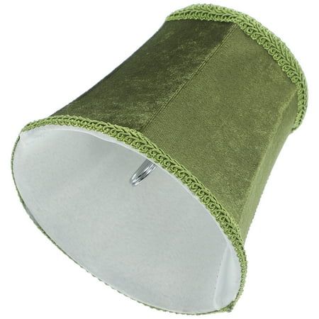 a green lamp shade with a white base