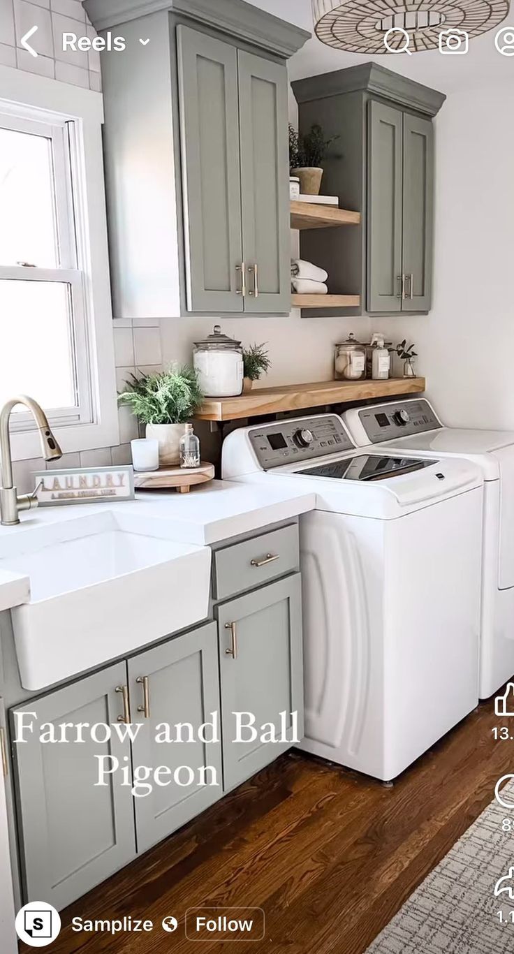 a kitchen with gray cabinets, white appliances and wood floors is featured in this magazine