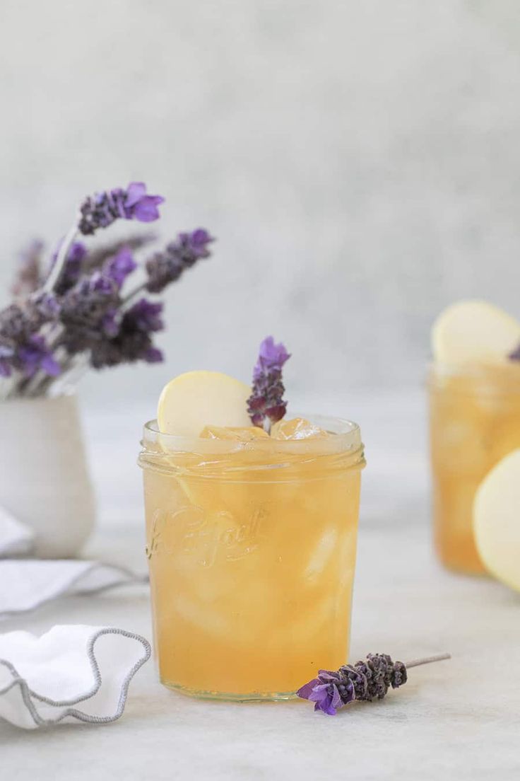 two glasses filled with lemonade and lavender