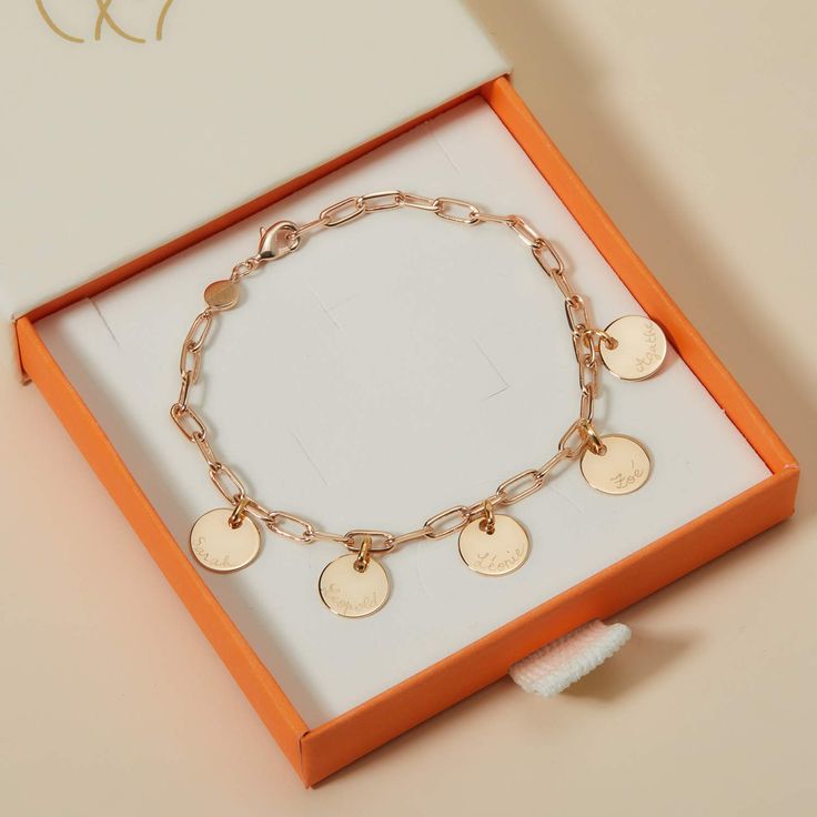 Our Dainty Love Links Bracelet is the perfect personalized bracelet for any occasion piece. Hand-engrave up to 14 characters and cherish the special memories forever.18K Champagne Gold Plated or 925 Sterling SilverChain length &amp; style: 7 Trace ChainCharm: 0.4 Diameter, 0.03 ThicknessCharms are not removable from this chainHand-engraved in our Paris workshopSent with love in a complimentary gift boxAny slight variations in lettering depth, spacing and alignment from the examples shown are Yellow Gold Bracelet With Engraving Option, Engraved Yellow Gold Charm Bracelet For Anniversary, Anniversary Engraved Yellow Gold Charm Bracelet, Luxury Engraved Bracelets For Personalized Gifts, Engraved Yellow Gold Charm Bracelet As Gift, Personalized 14k Gold Charm Bracelet For Anniversary, Rose Gold Charm Bracelet For Gift, Engraved White Gold Charm Bracelet For Anniversary, Elegant Initials Name Bracelet For Friendship