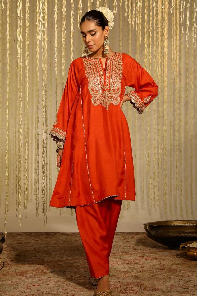 Orange anarkali with placed thread embroidered floral paisley motifs embellished by sequins. Comes with matching dogri salwar.
Components: 2
Pattern: Embroidered
Type Of Work: Thread, Sequin
Neckline: Notched
Sleeve Type: Three quarter
Fabric: Silk Dupion
Color: Orange
Other Details: 
Flared silhouette
Occasion: Sangeet,Mehendi and Haldi - Aza Fashions Pakistani Salwar Designs, Orange Anarkali, Purple Anarkali, Yoke Embroidery, Red Anarkali, Pink Anarkali, Aari Design, Paisley Pants, Silk Anarkali