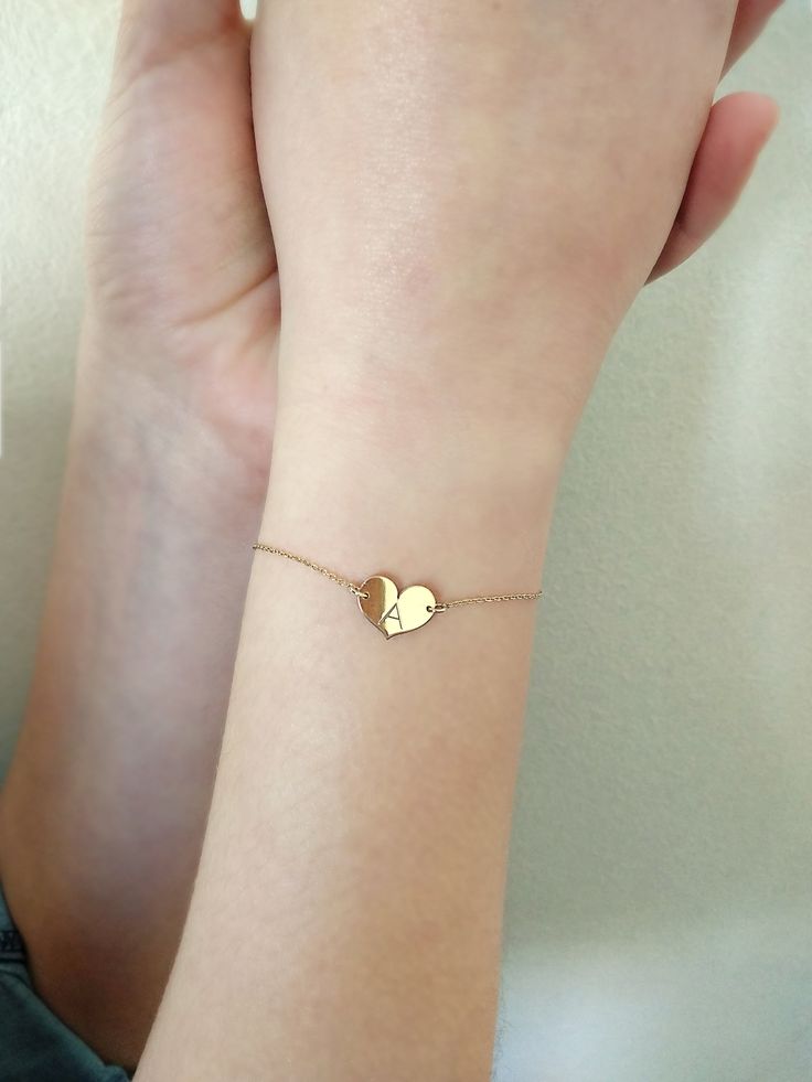 "14K 9K Small heart charm bracelet with Engraved Initial, Solid gold bracelet, Custom Monogram gold bracelet, Personalized gold bracelet, Valentine's Gift, Gift for her, 14K Rose Gold bracelet, Bridesmaid gift, Bridal jewelry, Dainty gold bracelet, FREE EXPRESS SHIPPING Delicate minimalist 14K solid gold bracelet with a small heart charm engraved with one or two initials. A wonderful and thoughtful gift for you and your loved ones! Infinity bracelet: https://www.etsy.com/listing/608986075 Boho e Double Heart Charm Jewelry For Best Friend, Heart Charm Double Heart Jewelry For Best Friend, Yellow Gold Charm Bracelet For Mother's Day Gift, 14k Gold Bracelet Gift For Mother's Day, Yellow Gold Charm Bracelet For Valentine's Day Gift, Dainty Yellow Gold Heart Bracelet For Mother's Day, Yellow Gold Charm Bracelet Gift For Valentine's Day, Anniversary Heart Pendant Charm Bracelet, Valentine's Day Gift Yellow Gold Charm Bracelet