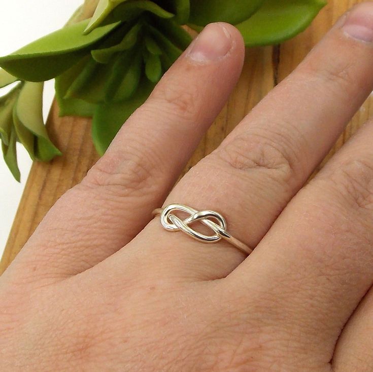 This Infinity Knot Ring is a dainty ring that shows your forever love, friendship, and appreciation for a special someone whether it be a wife, girlfriend, daughter, sister, or best friend. Solid Sterling Silver Infinity Knot Ring Band just over 1mm thick Infinity Knot Ring, Infinity Knot, Knot Ring, Forever Love, Love Ring, Dainty Ring, Ring Band, Sterling Ring, Infinity Bracelet