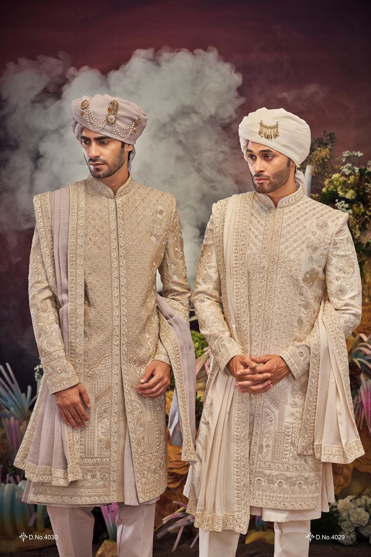 Make a grand statement on your special day with a luxurious Sherwani crafted from premium fabrics (like silk, brocade, or georgette) for ultimate comfort and sophistication. Our collection boasts a variety of designs to suit every taste: Classic elegance: Opt for a timeless Sherwani with intricate embroidery on the collar or cuffs. Modern flair: Go for a Sherwani with a unique neckline or a trendy color palette. Regal opulence: Choose a Sherwani with rich embellishments like zardozi work for a t Brocade Sherwani With Naqshi For Diwali, Diwali Brocade Sherwani With Naqshi Details, Diwali Brocade Sherwani With Naqshi, Long Jamawar Sets For Wedding, Embroidered Traditional Fit Sherwani For Wedding, Intricate Embroidered Brocade Sherwani For Eid, Gold Sherwani With Naqshi For Wedding, Embroidered Brocade Sherwani For Reception, Eid Brocade Traditional Wear With Naqshi