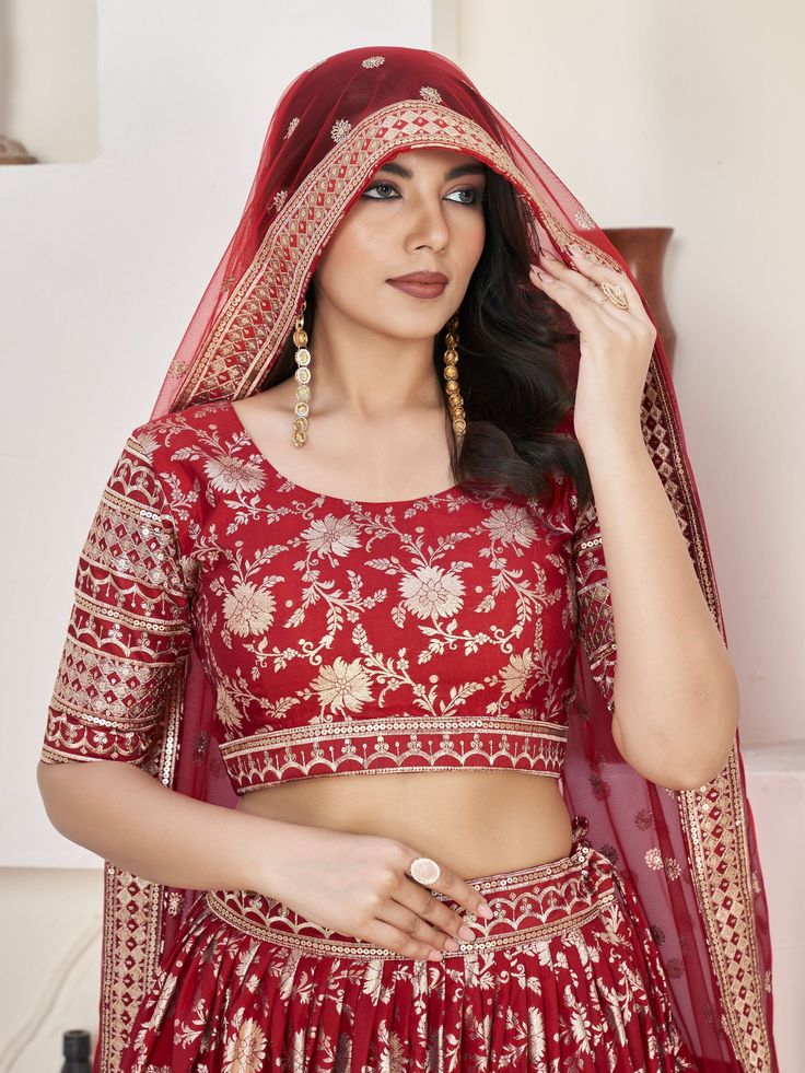 Introducing our stunning "glamorous red zari embroidered jacquard wedding lehenga choli" that is sure to make you stand out at any wedding or special occasion. This exquisite ensemble features a red color jacquard lehenga with intricate zari embroidered work and sequin work, paired with a matching jacquard choli and net dupatta. The lehenga is semi-stitched up to 42 inches, allowing for a perfect fit, while the choli comes as unstitched material for customization. The net dupatta with four side Red Banarasi Silk Saree For Reception, Reception Banarasi Silk Red Saree, Red Sets With Resham Embroidery For Traditional Ceremonies, Red Art Silk Wedding Set, Red Art Silk Anarkali Set For Wedding, Wedding Brocade Sets With Meenakari Details, Red Embroidered Fabric For Unstitched Blouse For Diwali, Red Banarasi Silk Lehenga With Intricate Embroidery, Red Dola Silk Lehenga With Dupatta