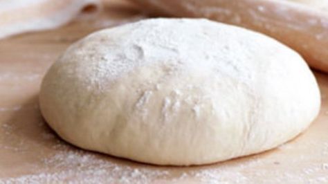 a ball of dough sitting on top of a table