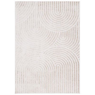 a white rug with wavy lines on the bottom and an oval design in the middle