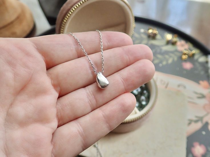 Introducing our Dainty Gold Vermeil Water Drop Necklace, a stunning piece that combines elegance with a touch of nature-inspired charm. Handcrafted with love and attention to detail, this necklace is a perfect accessory to adorn your neckline and add a delicate shimmer to any outfit.Crafted from high quality materials, this necklace features a dainty teardrop pendant, carefully shaped to resemble a beautiful water droplet. The pendant is .925 Sterling Silver plated creating a radiant and long-la Everyday Teardrop Sterling Silver Charm Necklaces, Everyday Sterling Silver Teardrop Charm Necklaces, Everyday Sterling Silver Teardrop Charm Necklace, Nickel-free Teardrop Pendant Necklace For Everyday, Silver Charm Necklace With Oval Pendant And Clavicle Chain, Everyday Nickel-free Teardrop Pendant Necklace, Dainty Teardrop Sterling Silver Charm Necklace, Dainty Sterling Silver Teardrop Charm Necklace, Everyday Sterling Silver Teardrop Pendant Necklace