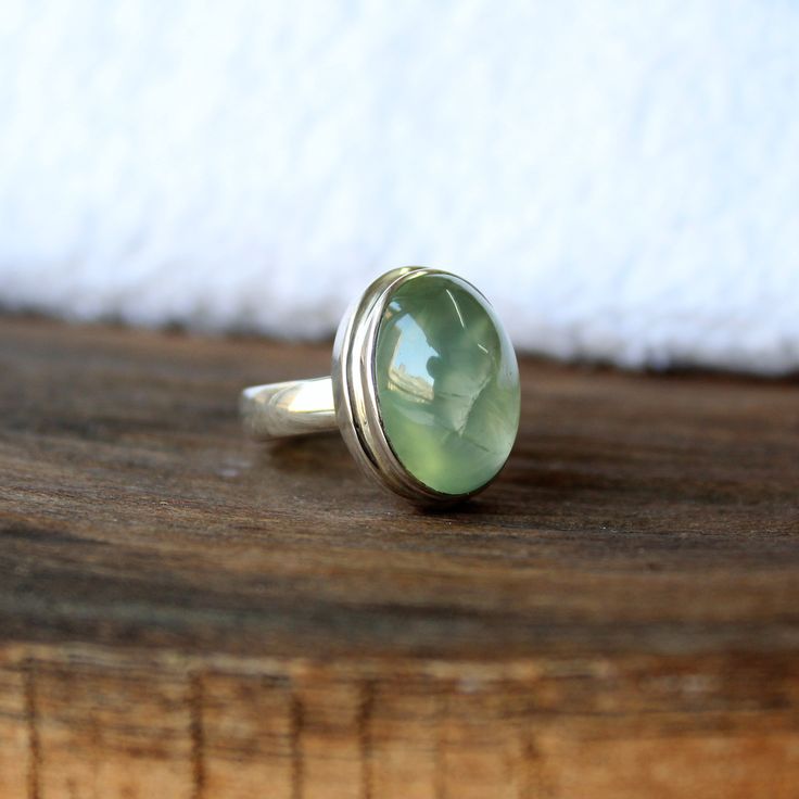 Natural Prehnite ring, Real Sterling Silver ring, cocktail ring, alternative engagement ring, avant garde, birthstone ring, prehnite jewellery Description: Be assured that the product you order is MADE JUST FOR YOU and is not a mass produced item. The gemstone is a OVAL shaped PREHNITE GEMSTONE SIZE-16*12 mm. You have an option to choose a gem for yourself from a set of the stones. Please ask. The rest of the ring is made from 925 STERLING SILVER i.e 92.5% pure silver. And it DOESN'T HAVE ANY LE Artisan Gemstone Promise Rings, Artisan Gemstone Rings For Anniversary, Handmade May Birthstone Ring, Bohemian Green Oval Cabochon Ring, Handmade Green Oval Crystal Ring, Handmade Green Birthstone Ring For Anniversary, Handmade Green Birthstone Promise Ring, Unique Green Sapphire Promise Ring, Unique Gemstone Toe Ring