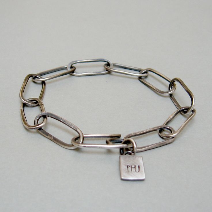 Sterling silver bracelet, with hammered rectangular links. An exclusive design bracelet. The clean and elegant line makes it versatile and pleasing to be worn every day. A perfect gift for him or her Length 20.5 cm Width 0.8 cm Weight 10 g. The processing of hammer links gives each piece uniqueness and exclusivity. Simple jewel, but made original by craftsmanship, which adds value and features to each of my pieces. Thank you for the visit, follow me on Instagram; @Petrahjewelry Facebook: @Petrah Modern Silver Chain Bracelet For Everyday, Silver Oval Link Chain Bracelet Minimalist Style, Silver Bracelets With Rectangular Links For Everyday, Minimalist Silver Oval Link Chain Bracelet, Sterling Silver Paperclip Bracelet With Solid Link Construction, Sterling Silver Paperclip Bracelet With Solid Link, Modern Link Chain Bracelet With Sterling Silver Clasp, Silver Sterling Bracelets With Rectangular Links, Modern Silver Link Chain Bracelet