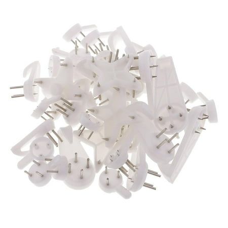 many white plastic clips and pins on a white background