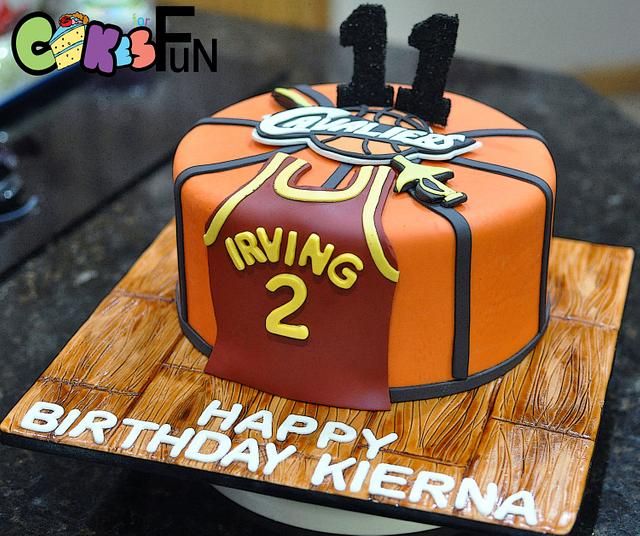 a birthday cake for a two year old boy with the number one on it and basketball jersey