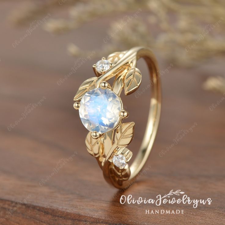 ▶ Ring Details:
※Metal: Silver or 14K Solid Gold (Rose, White, or Yellow)

▶Engagement Ring：
※Center Stone: Moonstone
※Shape&Quality: Round cutting
※Center Carat Weight: 6.5mm/approx1.5ct

※Side Stone Type: Colorless Moissanite
※Shape&Quality: Round cutting, DEF/VVS-VS
※Stone Carat Weight: approx0.05ct
※Band Width: approximately 1.8mm Engagement Ring Leaf, Moonstone Engagement, Moonstone Engagement Ring, Gold Art Deco, Silver Engagement Rings, Gold Art, Ring Unique, Womens Engagement Rings, Ring For Women