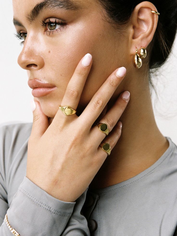 The 14k Gold Filled Signet Ring is our modern take on the classic signet style that has been around for decades. A perfect statement ring, or addition to your pinky, our 14k Gold Filled Signet Ring will become an heirloom in your capsule collection. Details 14k Gold Filled Available in 5 sizes Can be engraved Please note that as all items are handmade to order, please allow for 1-3 days of handcrafting before despatch. However, if you wish to have your item fast-tracked, please email us at contact@loveisabelle.com where we will be more than happy to assist you. If purchasing more than one item, and require individual boxes for your jewellery, you can purchase them here. Gold Dome Ring With Smooth Bezel In 14k Gold, 14k Gold Oval Stackable Rings Tarnish Resistant, Everyday 14k Stamped Jewelry With Round Band, Everyday 14k Gold Oval Jewelry, Classic Midi Rings In Recycled Gold, Heirloom 14k Gold Dome Ring Tarnish Resistant, Timeless Rose Gold Open Signet Ring, Everyday Fine Jewelry Engraved 14k Gold Ring, 14k Gold Polished Open Signet Ring