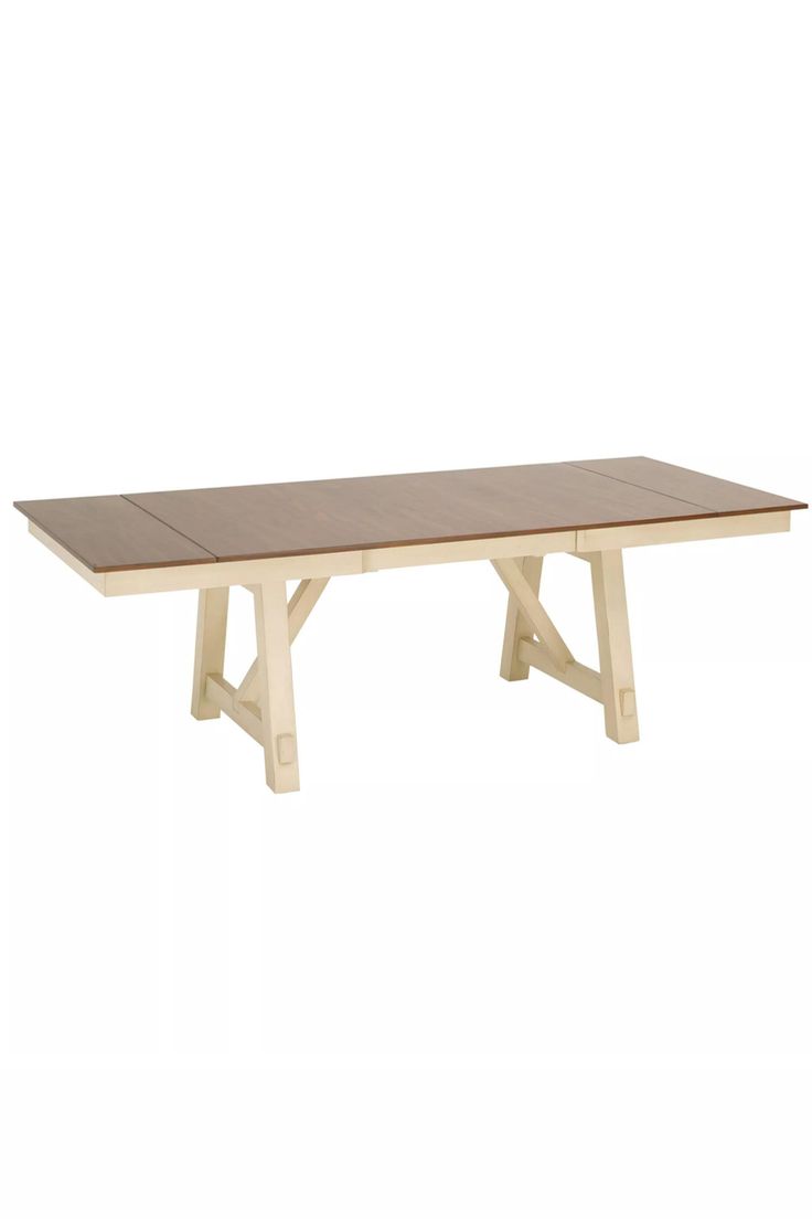 a wooden table sitting on top of a white floor