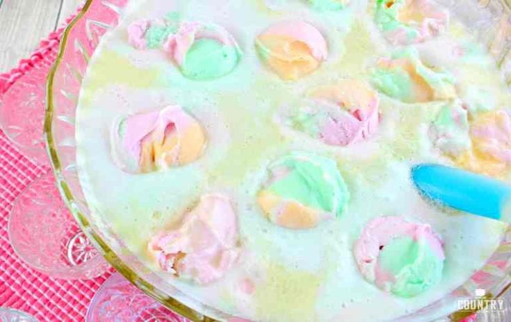 a cake that has been frosted with icing and colored powders on it