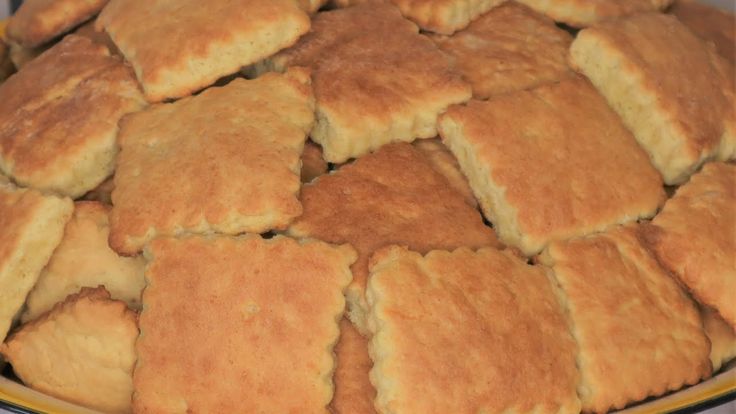 a plate full of biscuits on a table