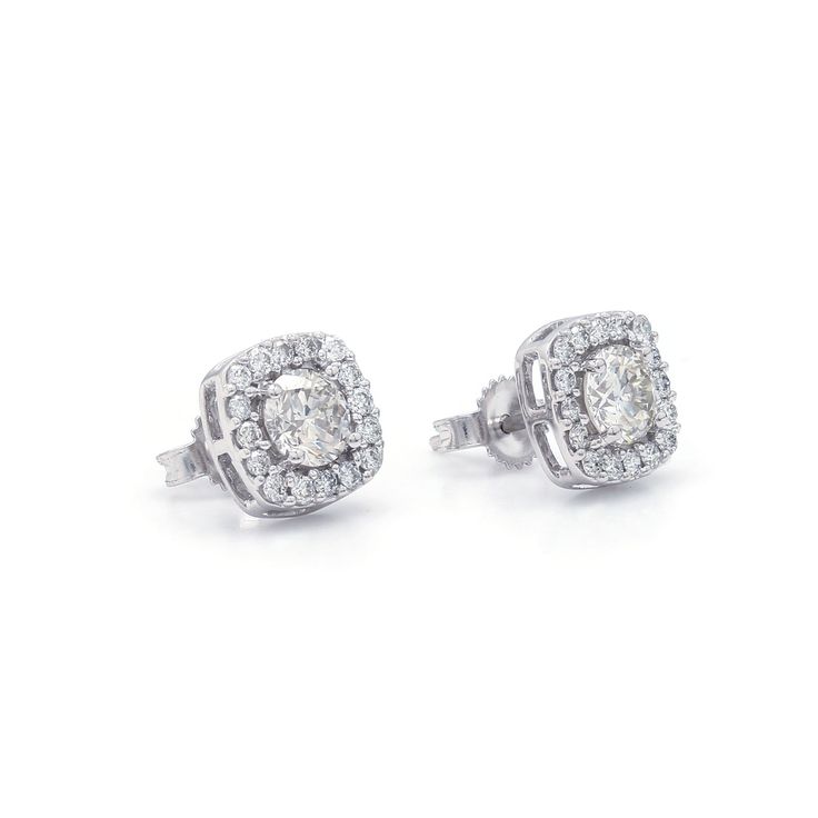 The Rosemary Earrings Make a wonderful impression with these beautiful halo stud earrings. Crafted in 14K white gold, each breathtaking earring features lustrous I-J, VS-SI center lab grown diamond for a 0.70 carat total weight combined, wrapped in a frame of shimmering petite lab-created diamonds with a total weight of 0.30 carats. Polished to a bright shine, these post earrings secure comfortably with friction backs. This Sku number is 456709 An IGL certificate can be requested, please allow t Halo Design Cluster Earrings In Cubic Zirconia, Anniversary Cluster Earrings With Halo Setting, Anniversary Cluster Diamond Earrings With Halo Setting, Diamond White Halo Design Cluster Earrings, Cluster Halo Diamond Earrings For Anniversary, White Cluster Diamond Earrings With Halo Design, White Cluster Halo Diamond Earrings, Diamond White Cluster Diamond Earrings With Halo Setting, Cluster Halo Diamond Earrings Gift