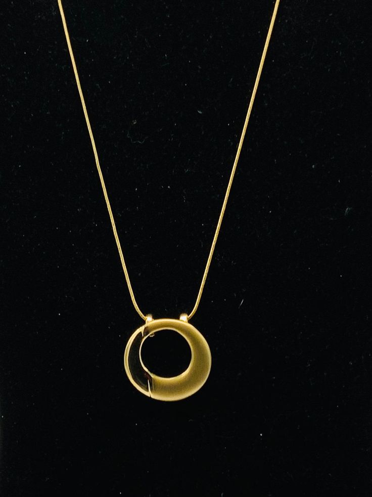 Round gold tone necklace by Lia Sophia Gold-tone Round Pendant Necklace, Gold-tone Necklace With Large Pendant, Formal Gold Charm Necklace, Modern Gold-plated Snake Chain Necklace, Modern Gold Plated Snake Chain Necklaces, Elegant Gold-tone Medallion Necklace With Adjustable Chain, Modern Gold Plated Snake Chain Necklace, Elegant Gold Long Charm Necklace, Elegant Gold-tone Medallion Necklace With Gold Chain