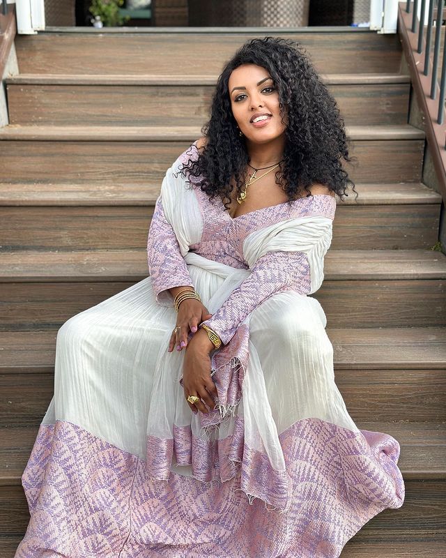 Experience the elegance of this gorgeous light color Habesha dress, showcasing a very beautiful design. This stylish Habesha Kemis and Ethiopian Traditional Dress effortlessly blends traditional grace with modern sophistication, making it perfect for any special occasion. Material Cotton Thread Menen Estimated delivery : 2 weeks to 3 weeks Contact WhatsApp +1(304)-306-2784Email: contact@ethiopian.store Pink Traditional Drape Dress For Spring, Traditional Pink Dress For Spring, Pink Spring Dress With Traditional Drape, Off White Party Dress With Traditional Drape, White Anarkali Kurta With V-neck, White Traditional Drape Maxi Dress, Off White Long Sleeve Anarkali Dress, Bollywood Style Spring Wedding Kaftan, Spring Wedding Bollywood Style Kaftan