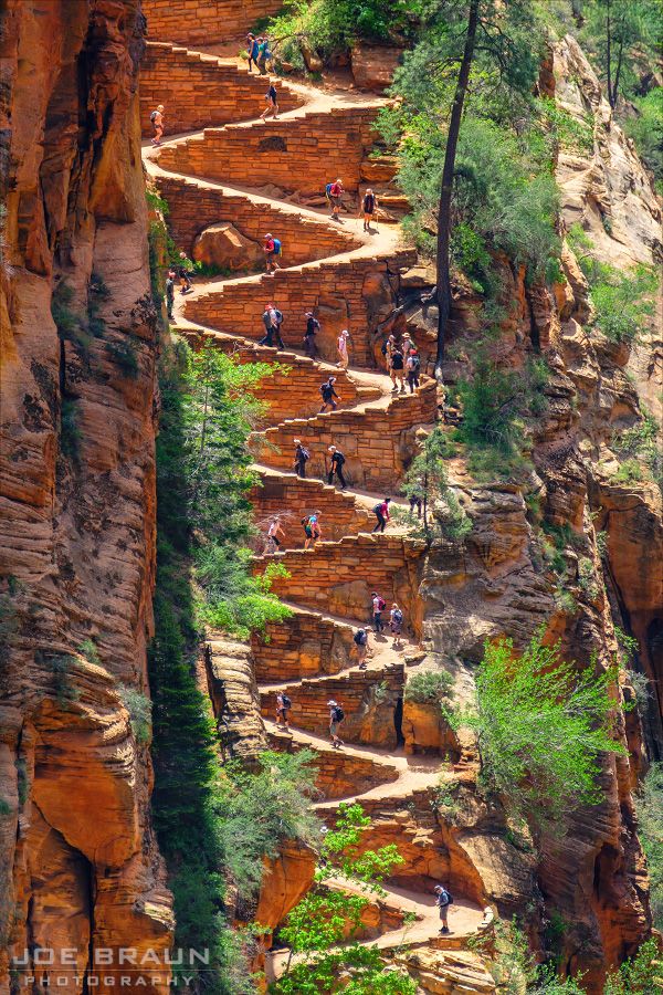 many people are walking up and down the stairs in the canyons that make them look like they're going to climb