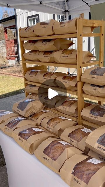 there are many bags of bread on the table