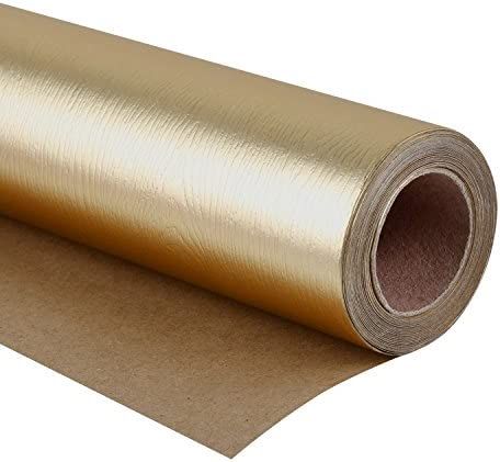 a roll of metallic foil on top of a piece of brown paper